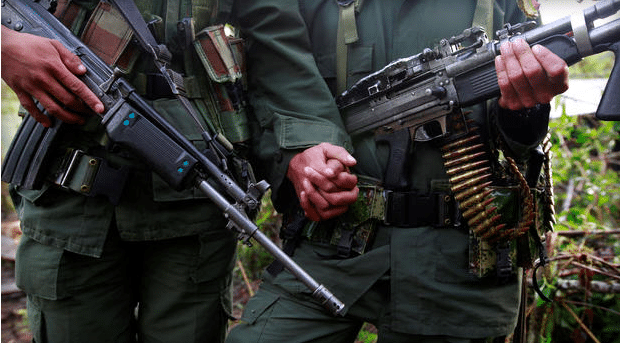 A couple from the 51st Front of the Revolutionary Armed Forces of Colombia (FARC) pose for the camera at a camp in Cordillera Oriental, Colombia, August 16, 2016. Picture taken August 16, 2016.  REUTERS